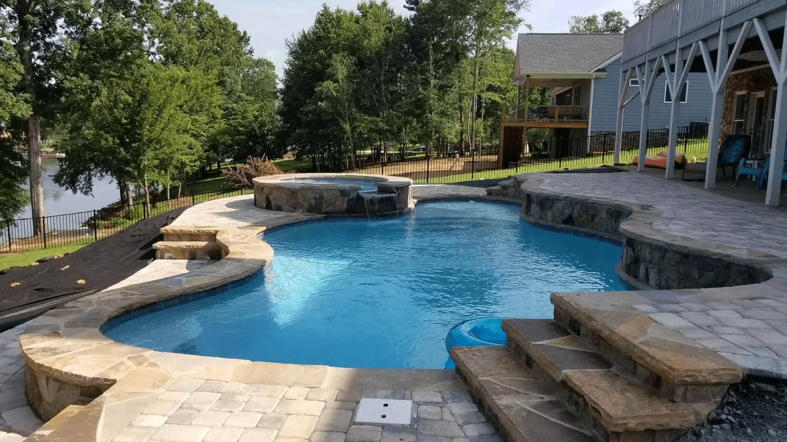 Finished custom poolscape with decking and landscaping