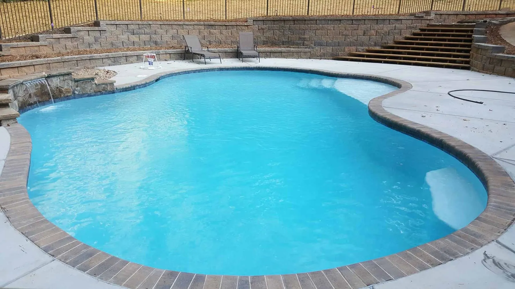 A custom concrete pool built by CPC Pools