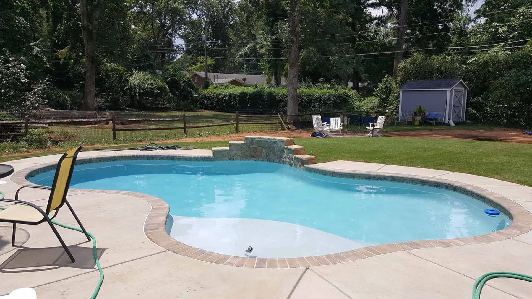 A custom concrete pool built by CPC Pools