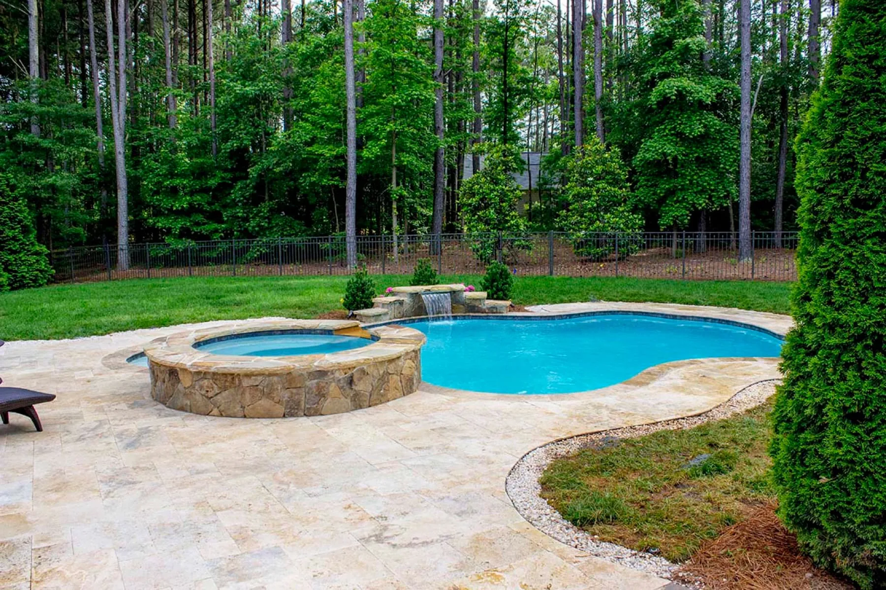 A custom concrete pool built by CPC Pools