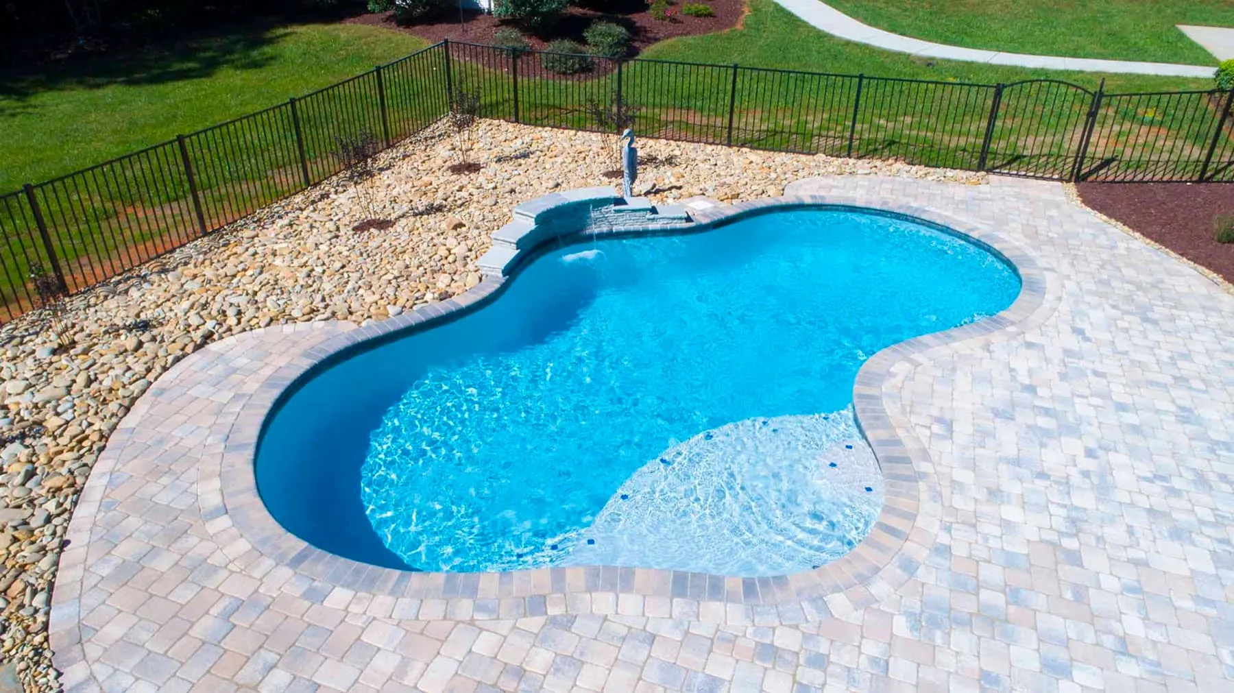 A custom concrete pool built by CPC Pools