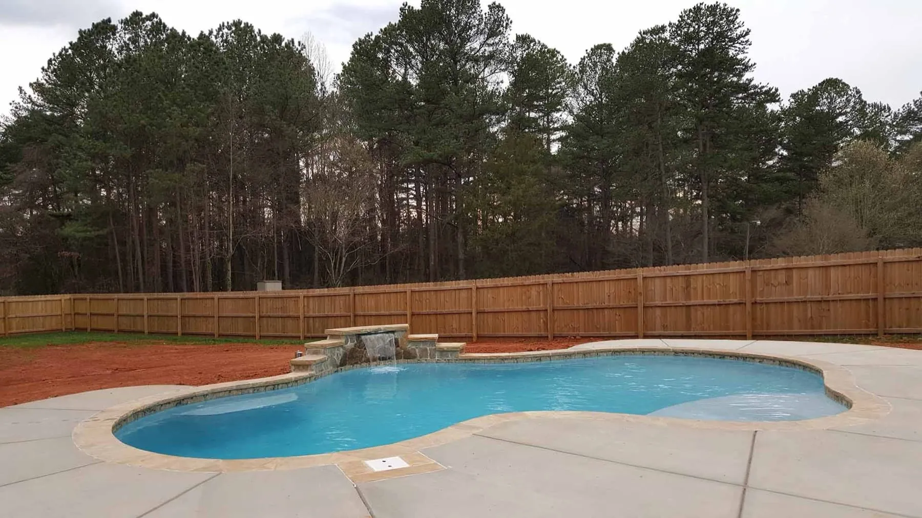 A custom concrete pool built by CPC Pools