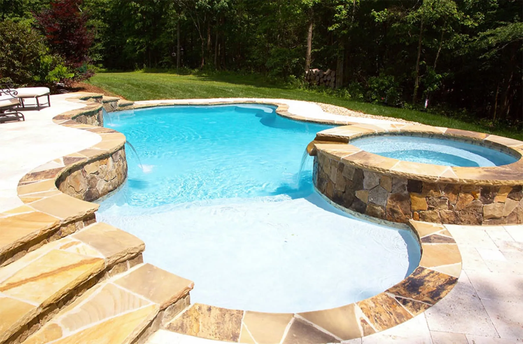 A custom concrete pool built by CPC Pools