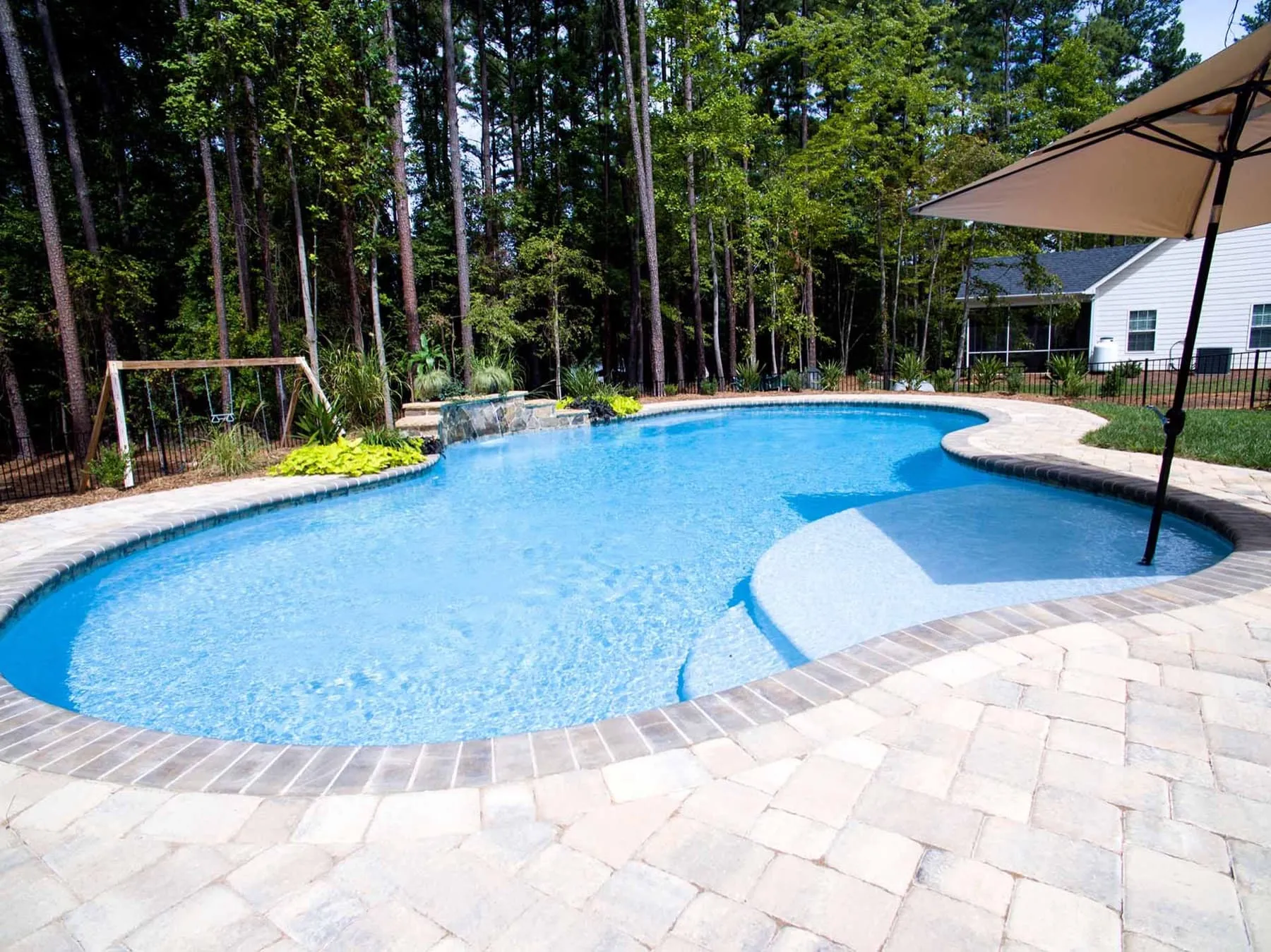 A custom concrete pool built by CPC Pools