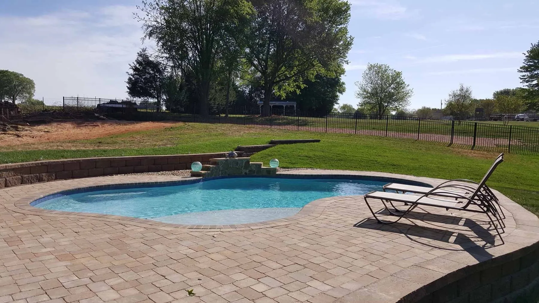 A custom concrete pool built by CPC Pools