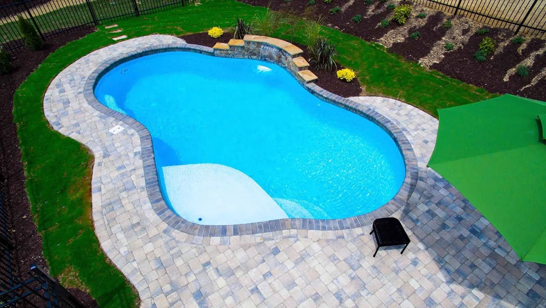 A custom concrete pool built by CPC Pools