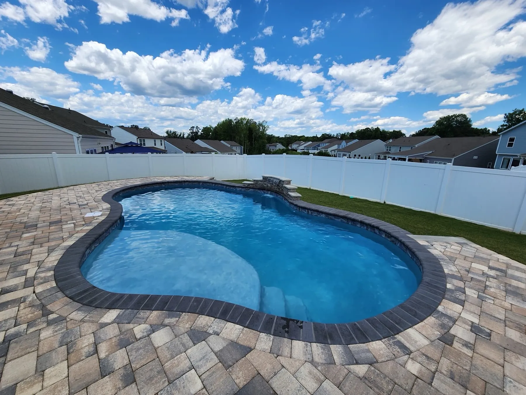 A custom concrete pool built by CPC Pools