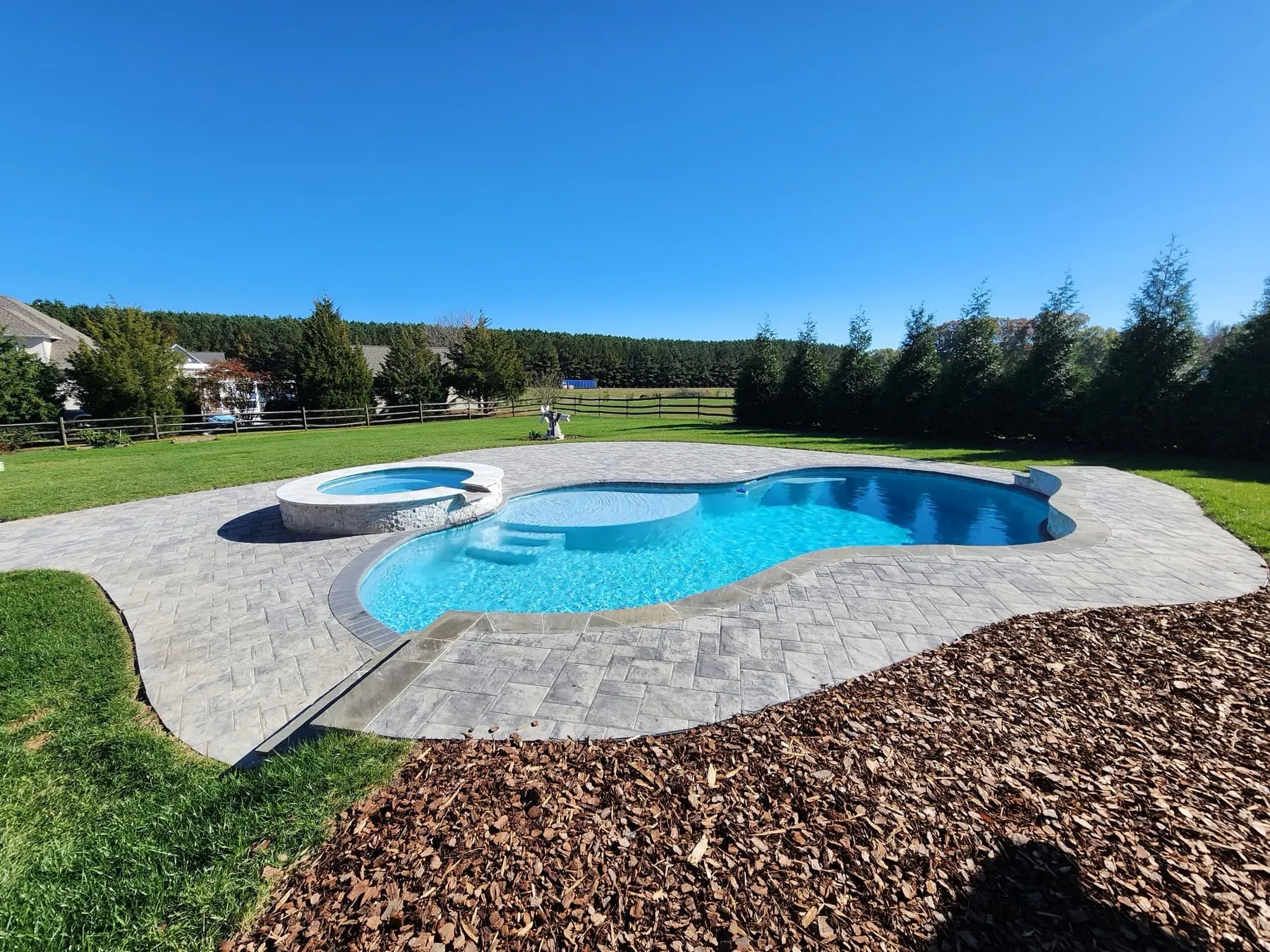 A custom concrete pool built by CPC Pools